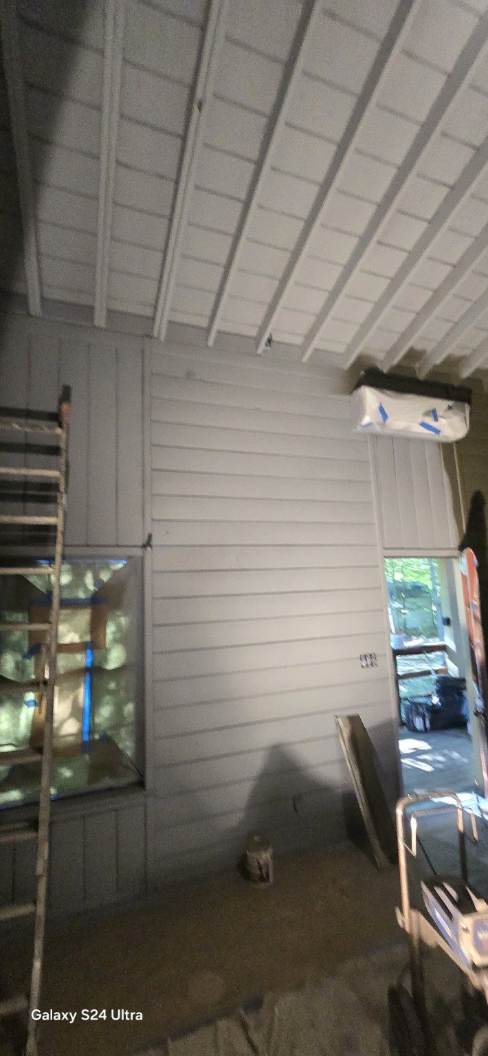 Painted siding and covered exterior area